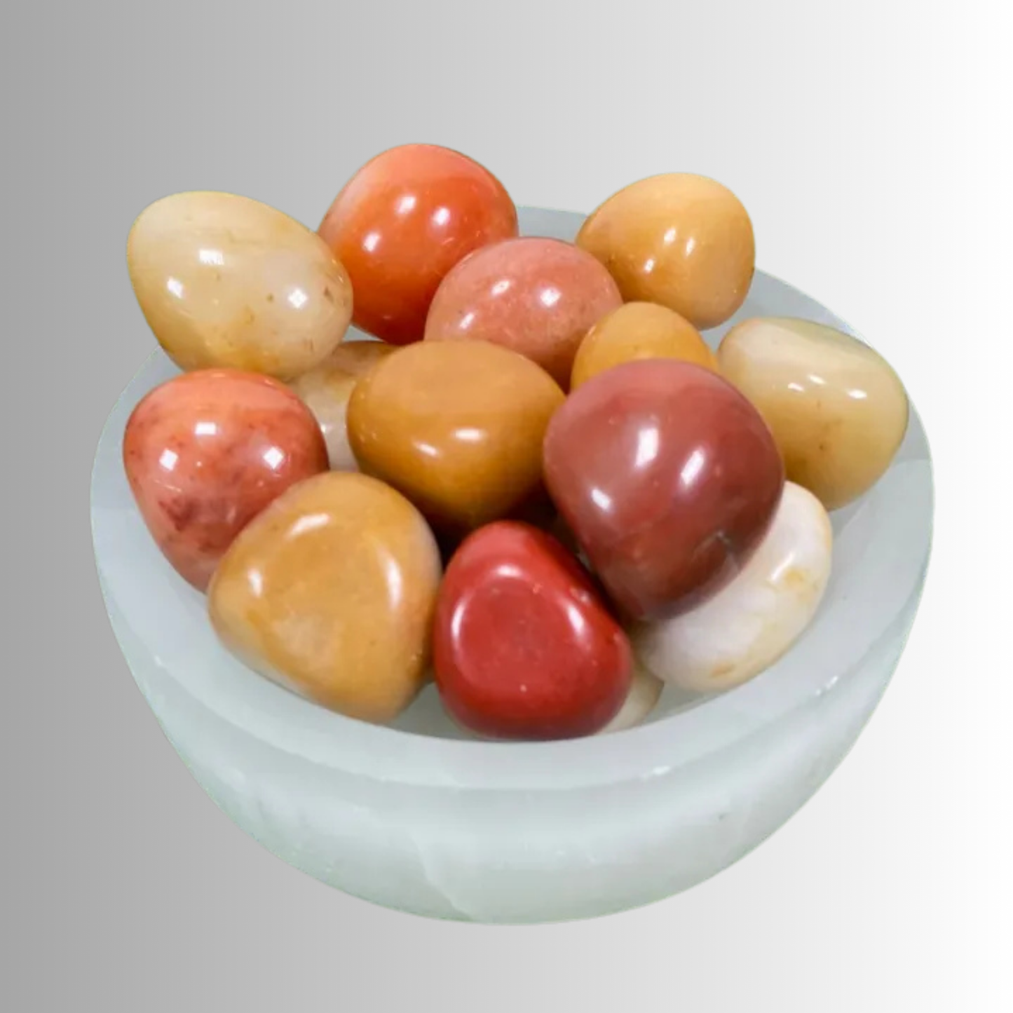 Tumbled Honey Onyx crystal in golden to amber hues, used for grounding, protection, emotional balance, and endurance