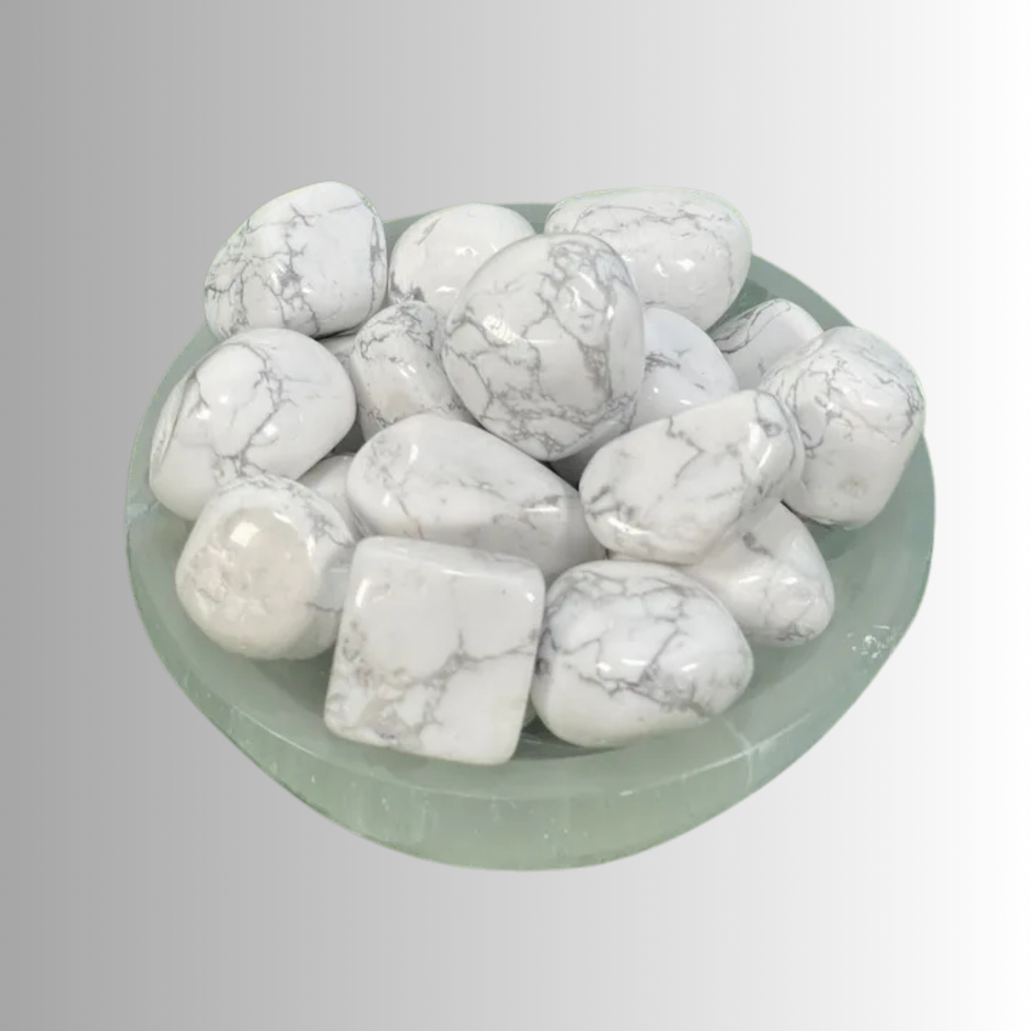 Tumbled Howlite crystal in white with gray veining, used for calm, patience, emotional healing, and spiritual awareness