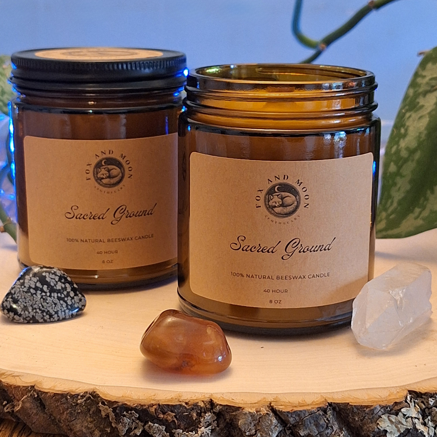 Sacred Ground 8 oz beeswax candle in amber glass jar with metal lid, natural wood wick, sage, cedarwood, and citrus fragrance for grounding, protection, and ritual use