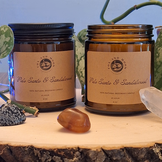 Palo Santo & Sandalwood 8 oz beeswax candle in amber glass jar with metal lid, natural wood wick, grounding palo santo and creamy sandalwood fragrance for meditation and relaxation