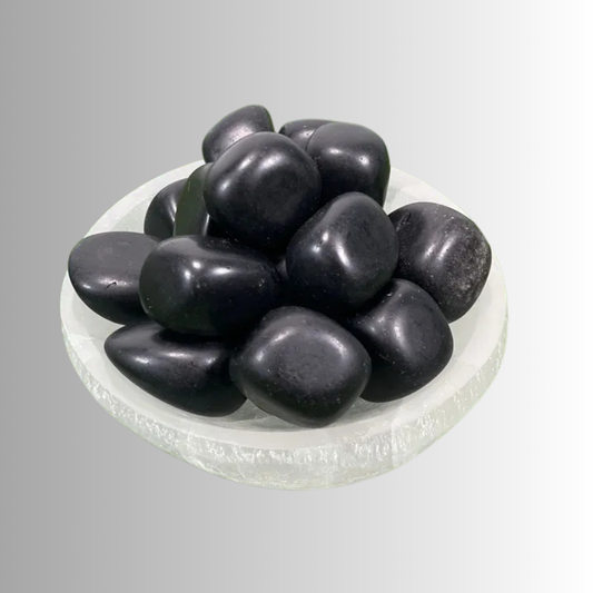 umbled Black Obsidian crystal with glossy black surface, used for protection, grounding, shadow work, and energy clearing