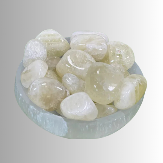 Tumbled Citrine crystal in golden to amber hues, used for abundance, joy, manifestation, and energy clearing