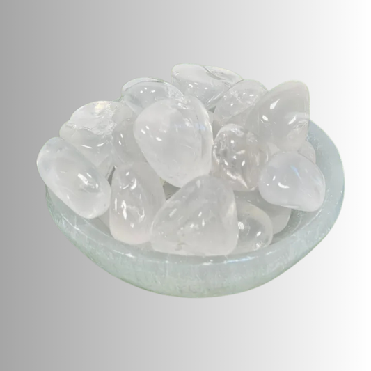 Tumbled Clear Quartz crystal, clear to milky with natural inclusions, used for clarity, healing, amplification, and intention setting