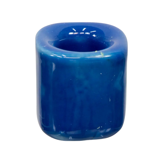 Dark blue ceramic chime candle holder holding a 4-inch chime candle, sturdy design for safe and elegant display
