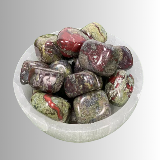 Tumbled Dragon Bloodstone crystal in deep green with red veining, used for strength, courage, protection, and transformation