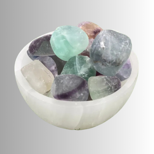 Tumbled Fluorite crystal in purple, green, and blue hues with natural bands, used for focus, clarity, protection, and intuition