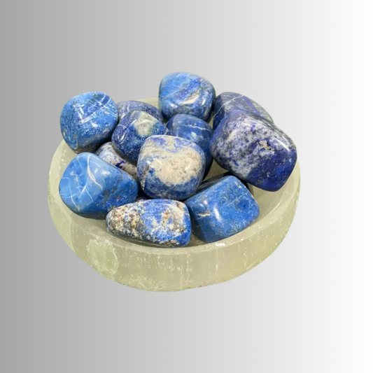 Tumbled Lapis Lazuli crystal in deep blue with gold flecks, used for wisdom, truth, intuition, and spiritual insight