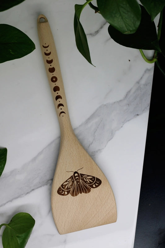 12-inch wooden spatula with engraved moon phases and moth design for kitchen witch or pagan decor