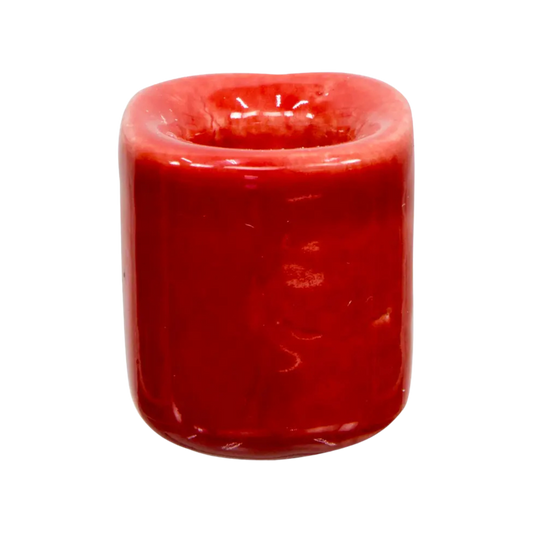 Red ceramic chime candle holder holding a 4-inch chime candle, elegant and functional design for ritual or decorative use