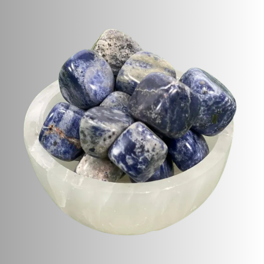 Tumbled Sodalite crystal in deep blue with white veins, used for insight, truth, calm, communication, and intuition