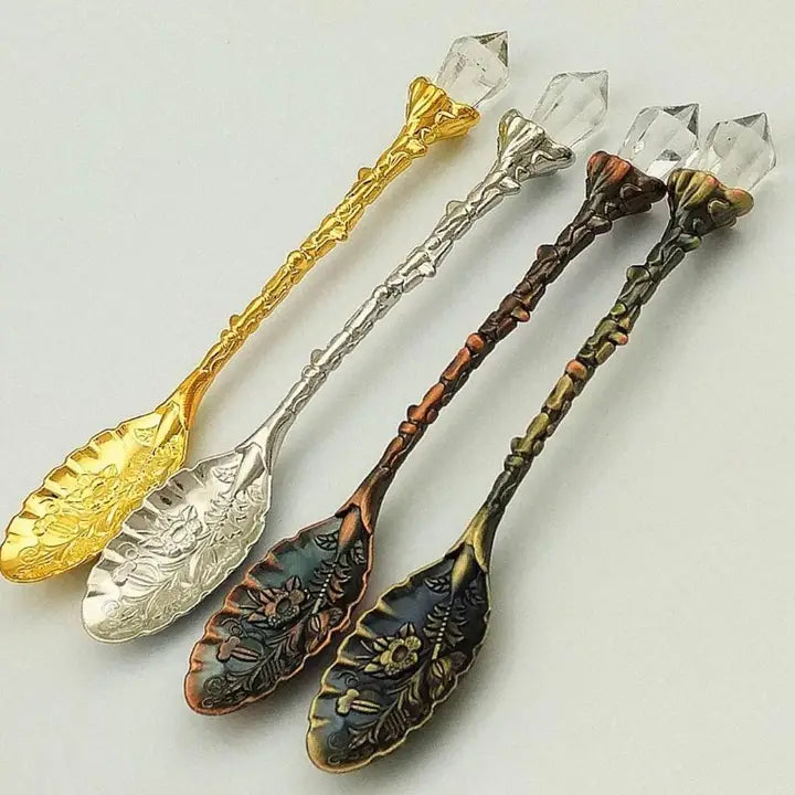 Crystal-handled herbal teaspoon with floral engravings for tea, herbs, or ritual use